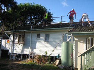 The old tiles and battens come off the roof